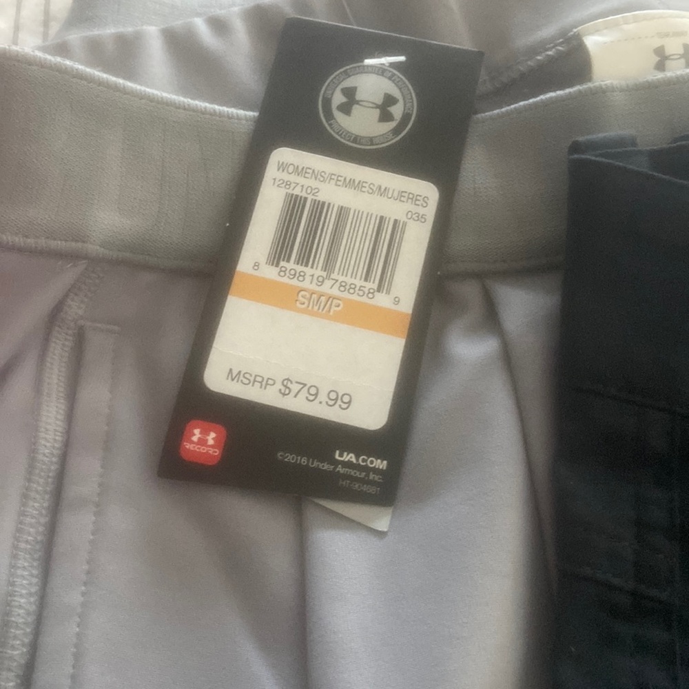 One gray underamour and Nike dark gray pants